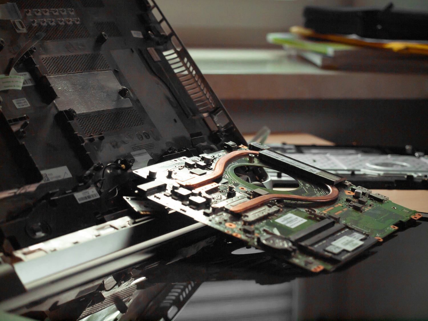 Close-up of a computer motherboard with visible components on a blurred background